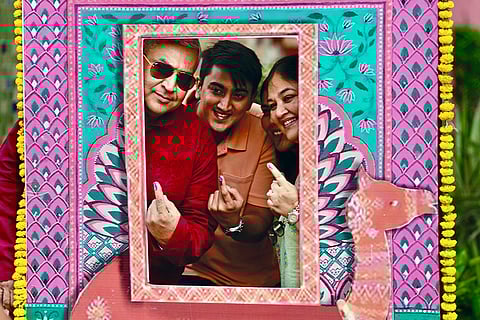 Voters pose at a selfie kiosk